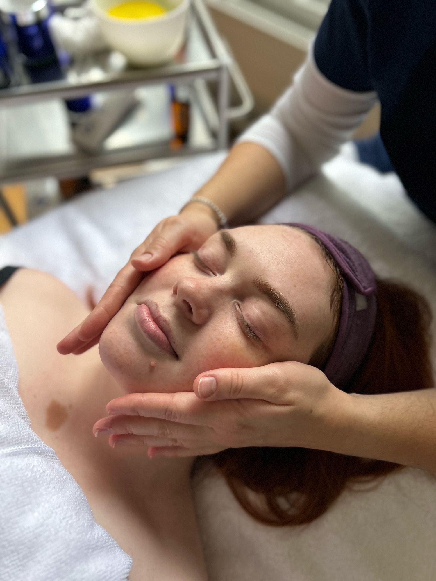 woman receiving treatment on face