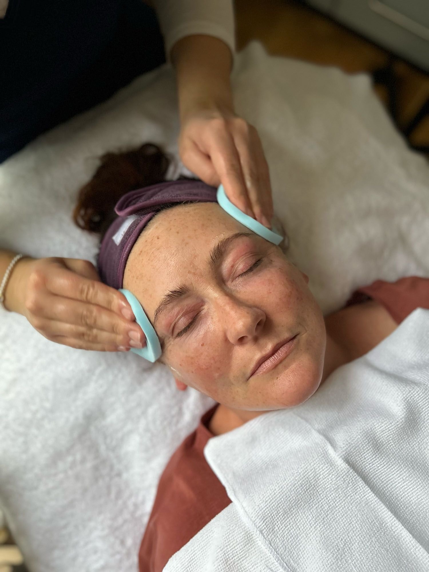woman receiving facial treatment