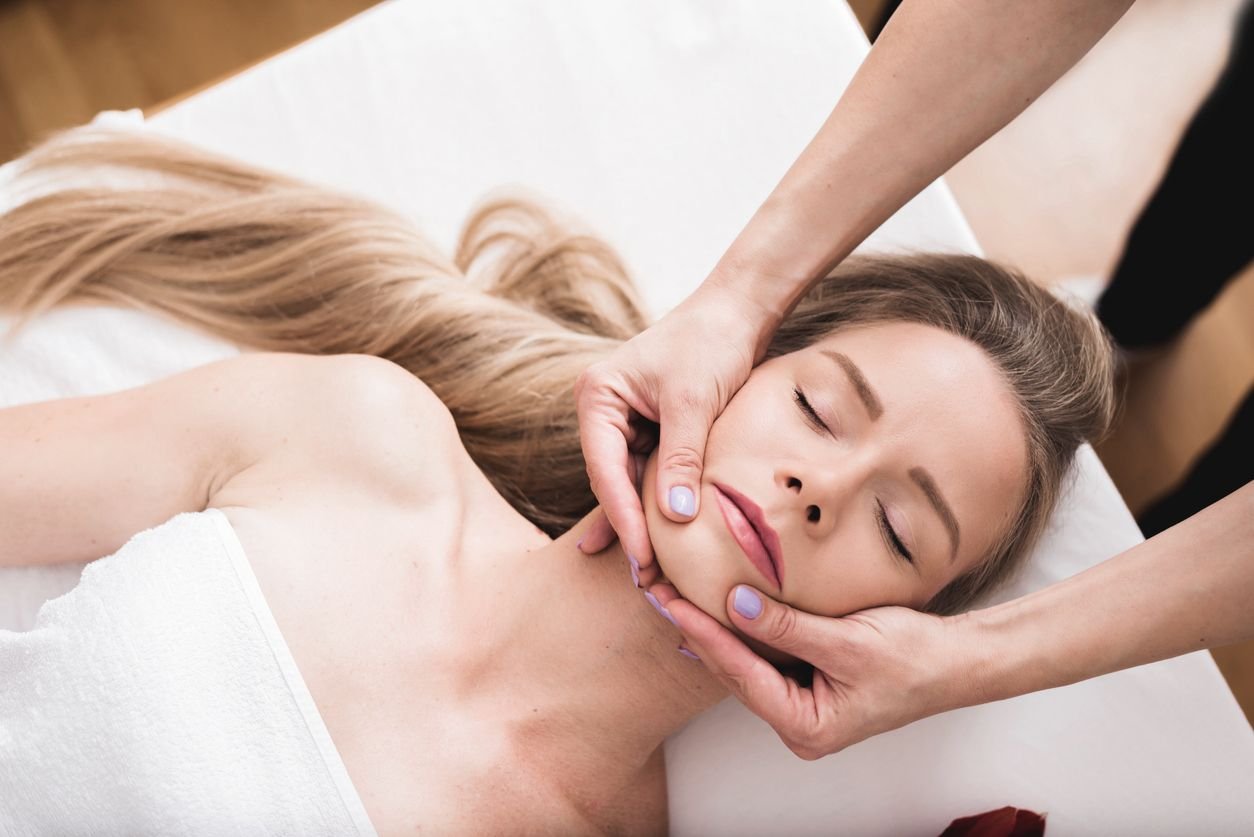 woman getting jaw examination from having pain